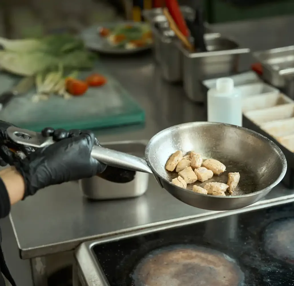 chef-cooks-meat-in-a-frying-pan-in-oil-2024-10-18-14-55-57-utc