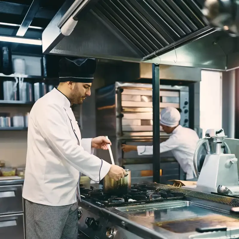 male-chef-cooking-in-the-kitchen-at-restaurant-2024-12-13-19-05-41-utc